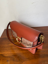 Load image into Gallery viewer, Coated Canvas Signature Tabby Shoulder Bag in Rust
