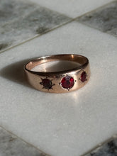 Load image into Gallery viewer, Garnet Starburst 10k Gold Trilogy Ring
