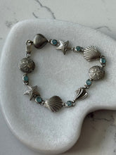 Load image into Gallery viewer, Blue Topaz Seashell Sterling Bracelet 7.25”
